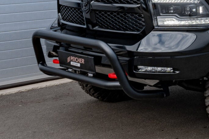 Closeup of a black bullbar fitted to a black Dodge Ram