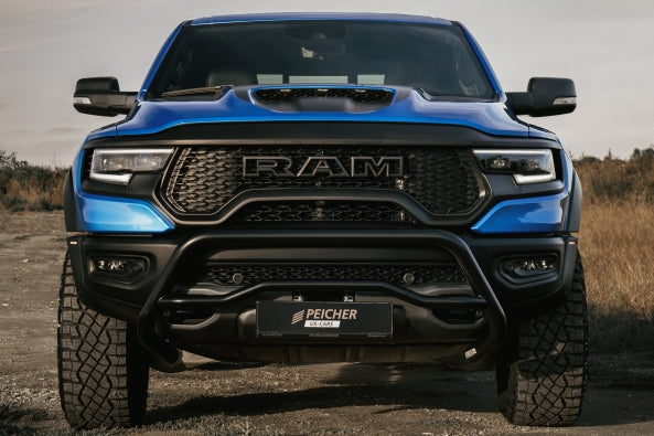 Frontal view of a blue Dodge Ram TRX with a black bullbar