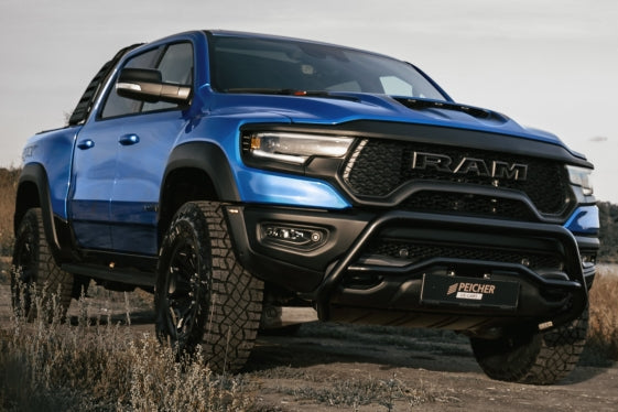 Blue Dodge Ram TRX with a black bullbar