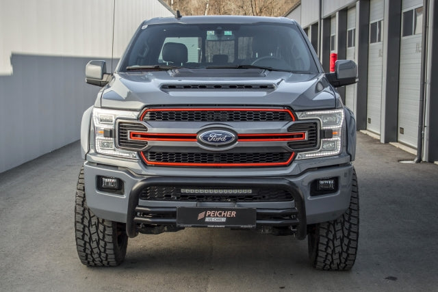 Front view of a lifted Ford F150 with a black bullbar