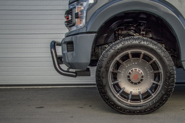 Side view of a black bullbar fitted to a lifted Ford F150