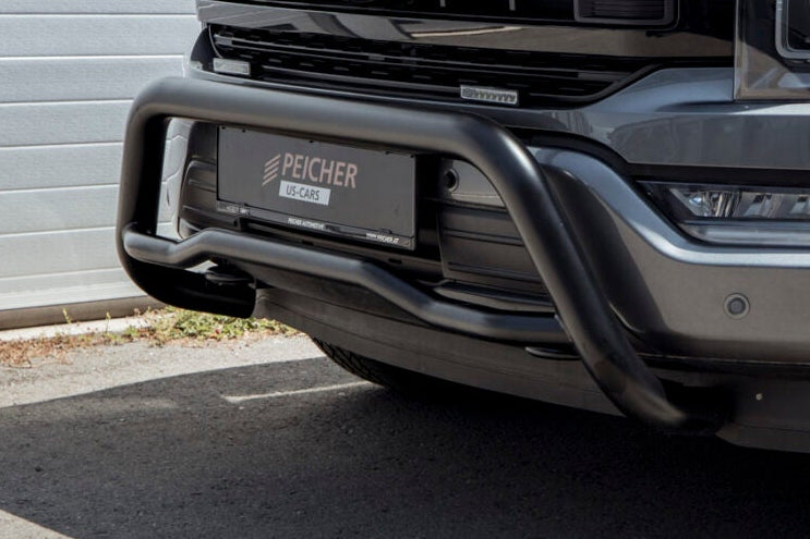 Closeup of a black bullbar on a grey Ford F150