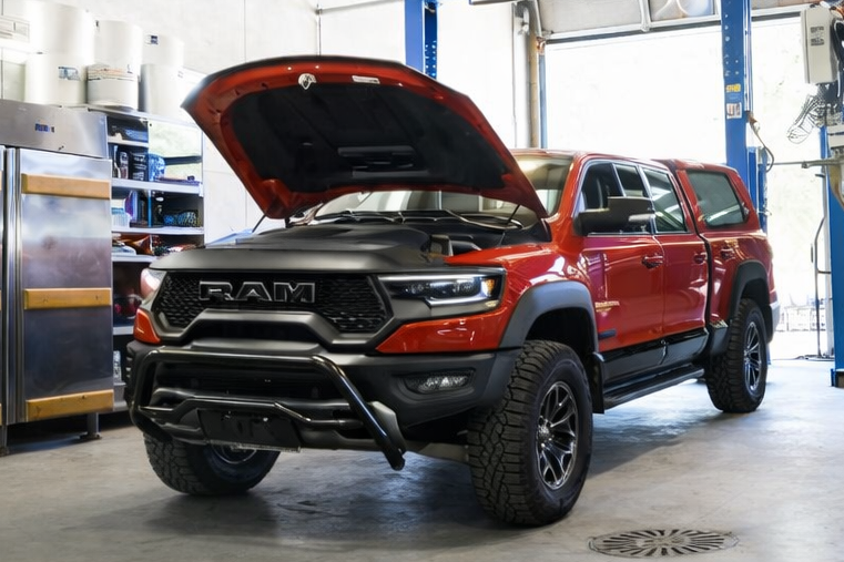 Dodge Ram Rebel with a black bullbar sitting in a garage