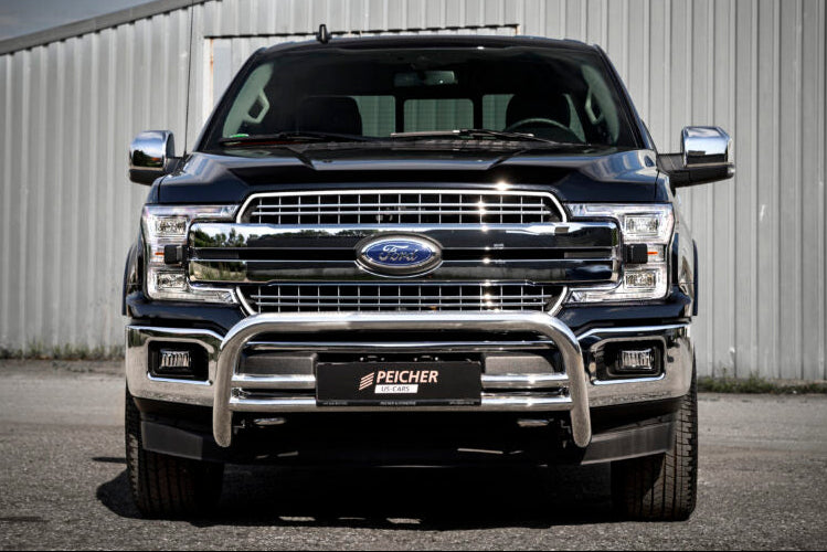 Front view of a blue Ford F150 with a stainless steel bullbar