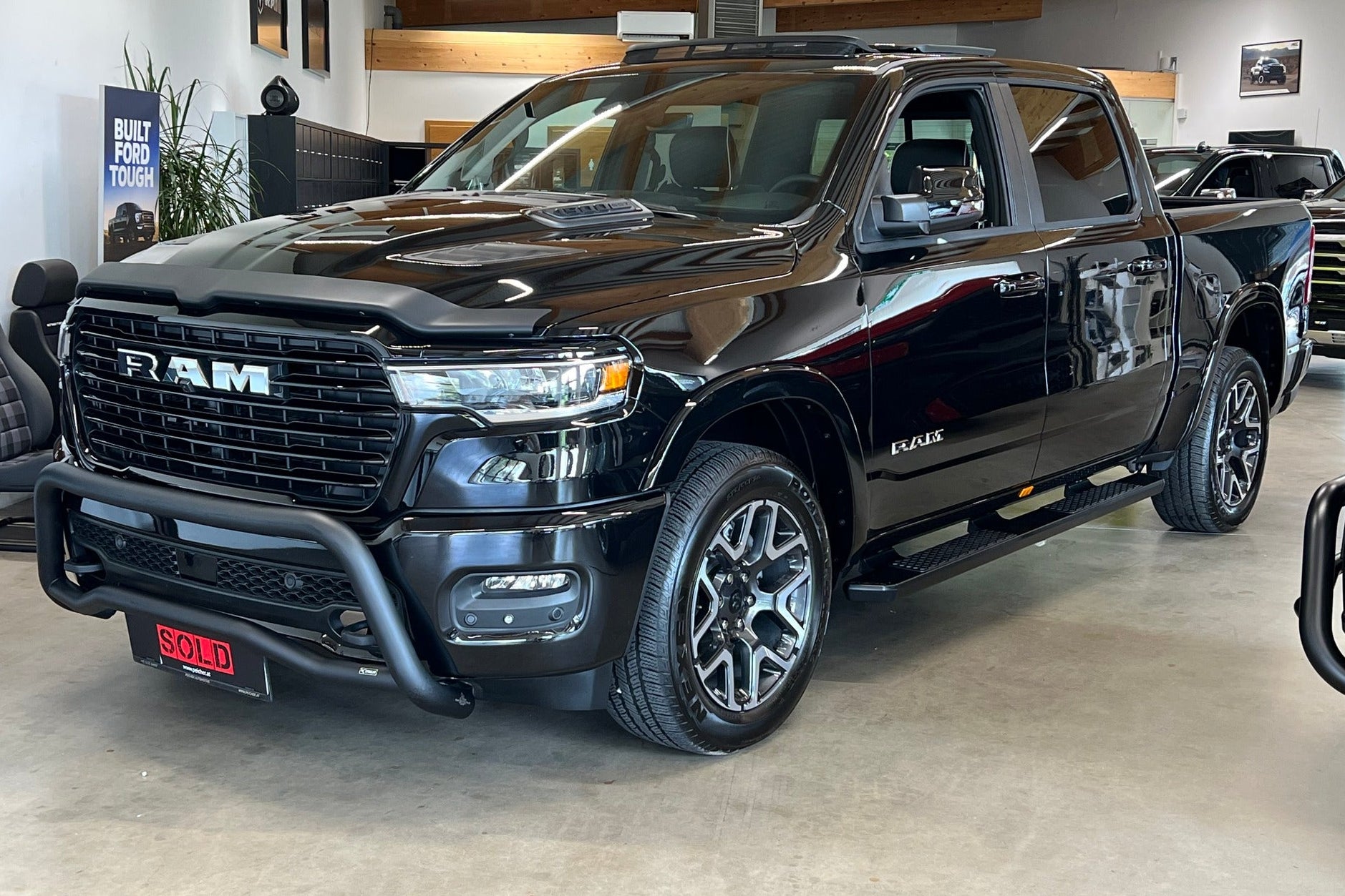 Black Dodge Ram truck with bullbar and sidesteps installed