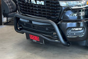 Closeup of a black Dodge Ram with a black bullbar installed