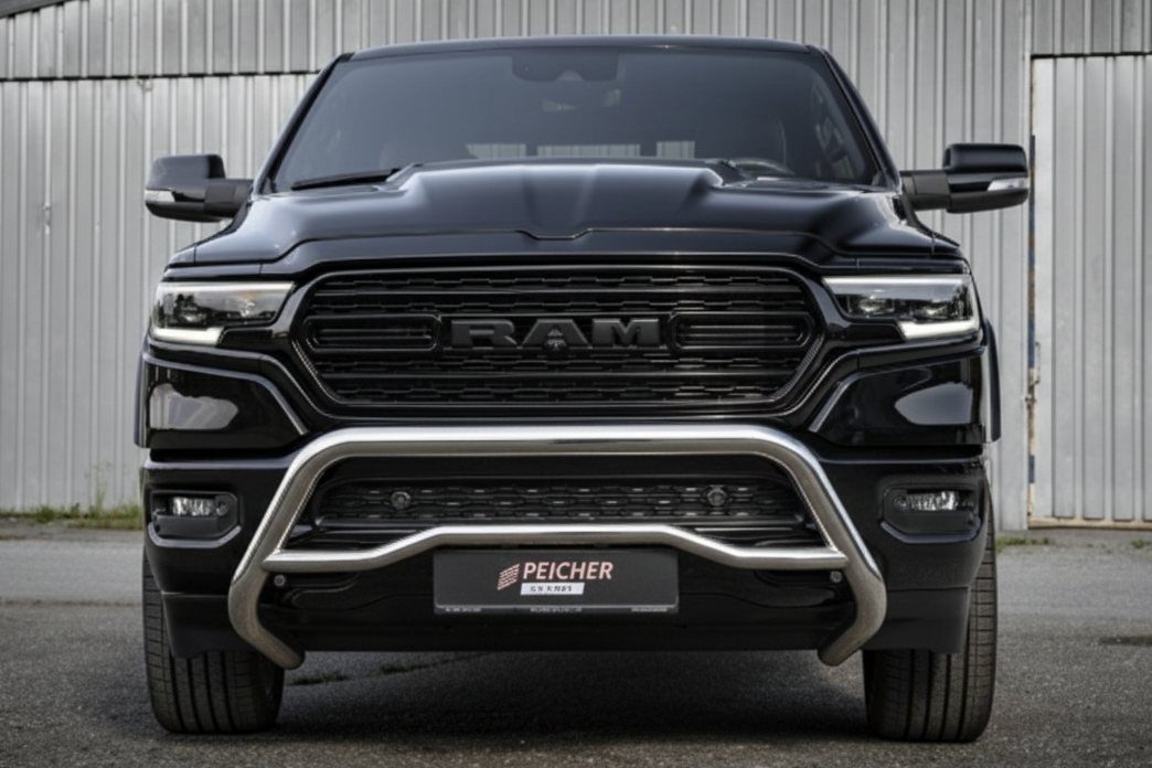 Frontal view of a black Dodge Ram truck with a stainless steel bullbar