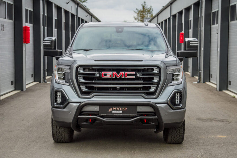 Frontal view of a GMC Sierra truck that has a black bullbar installed